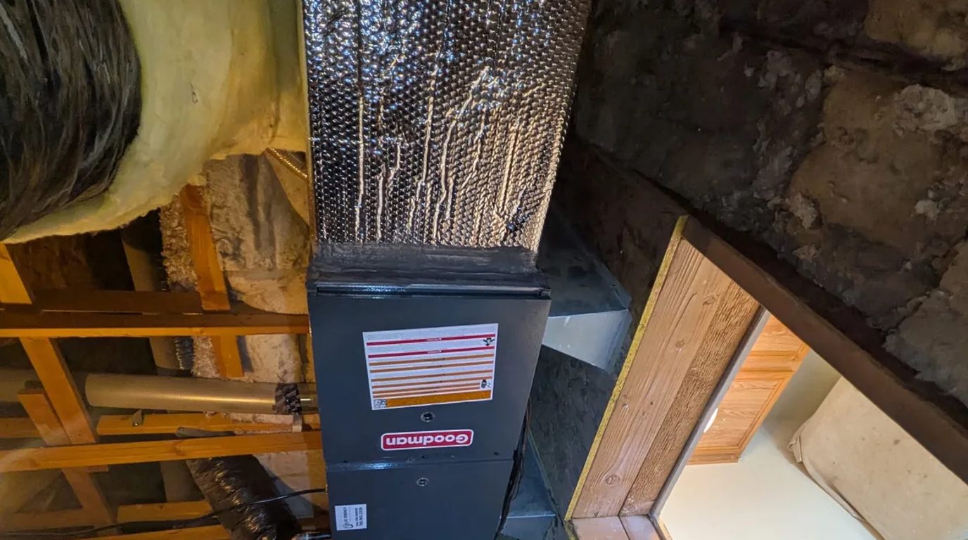 Goodman gas furnace installed in a High Desert attic with an insulated supply plenum
