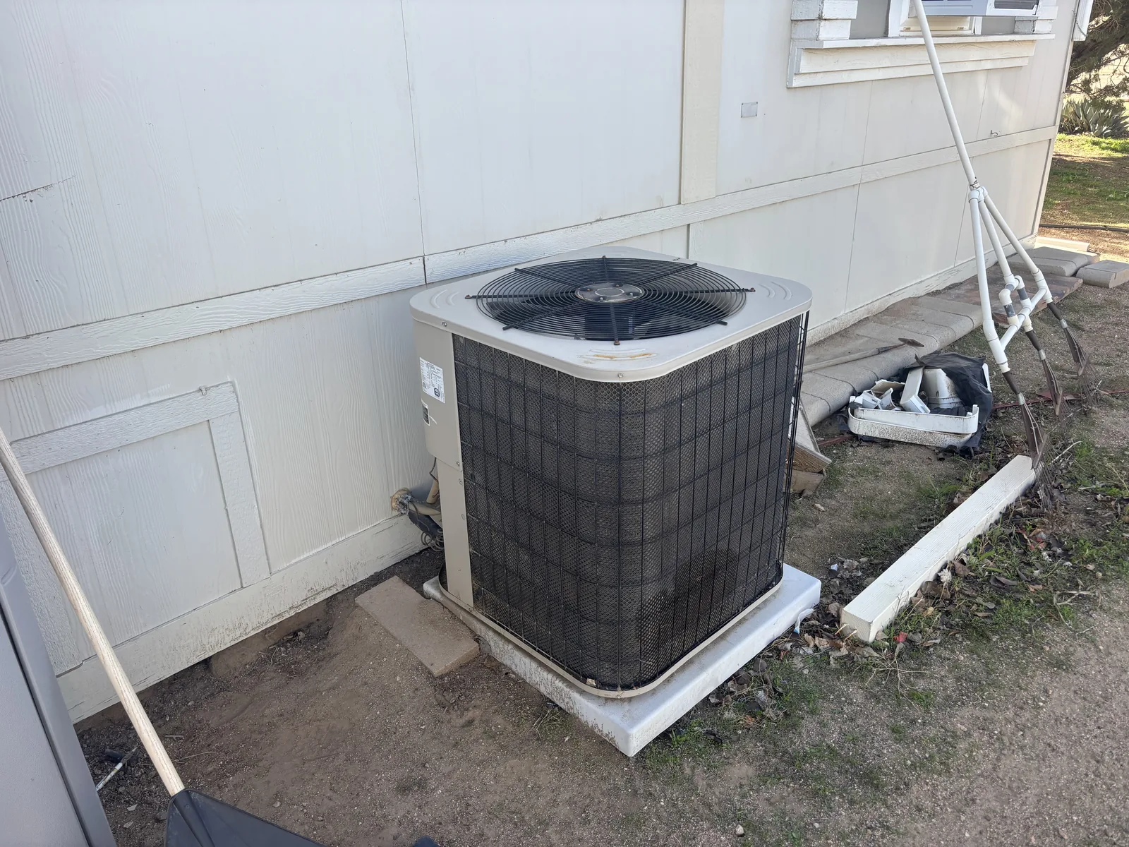 New outdoor AC condenser installed beside a High Desert home by JC Energy Solutions