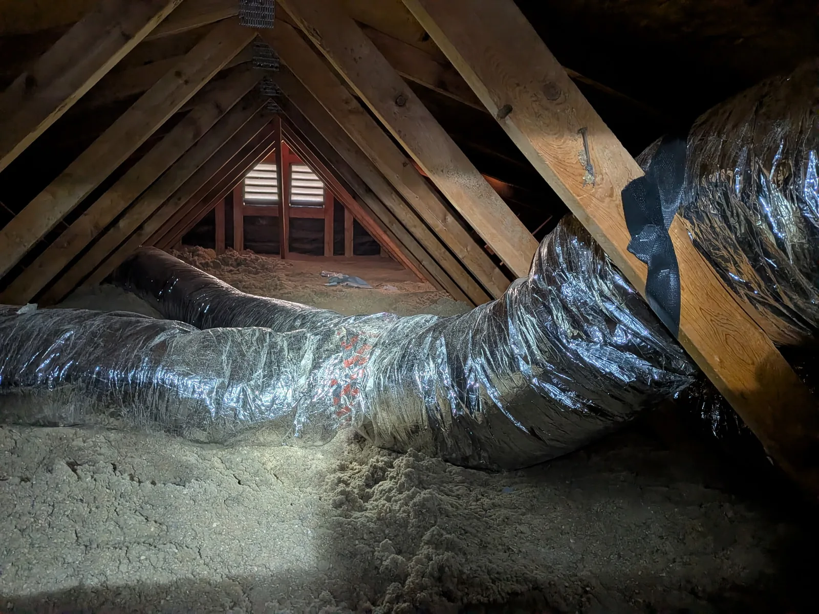 Insulated flexible ductwork installed across a High Desert home attic by JC Energy Solutions