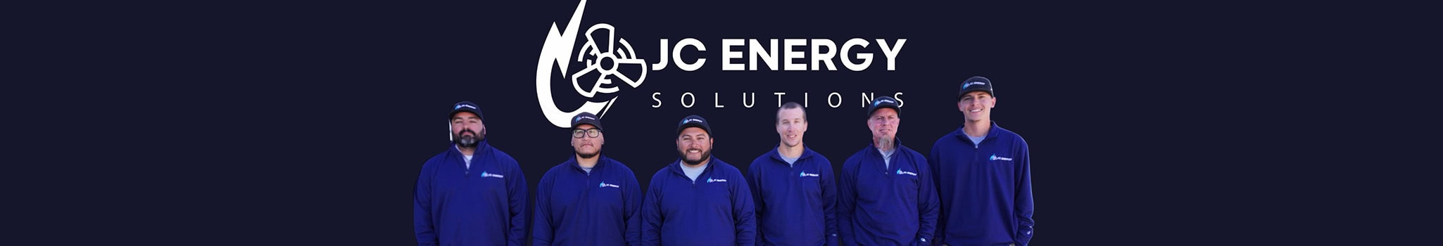 The JC Energy Solutions crew in front of the company logo