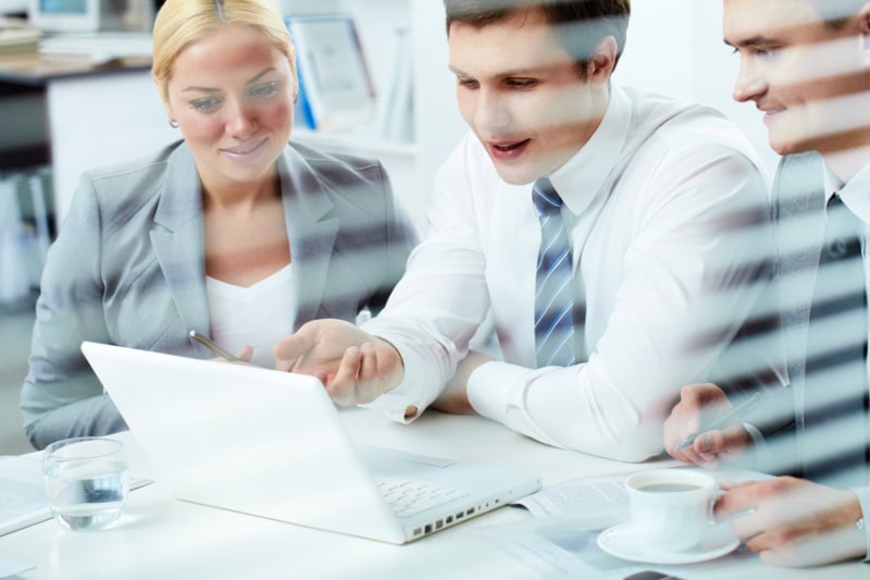 What Indoor Air Quality Accessories Can Help Keep Me Healthy? Photo of a group of business people working in the office together.